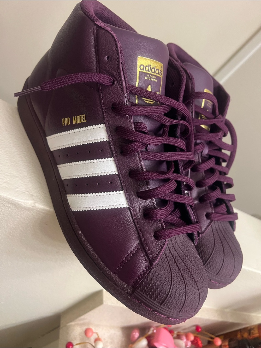 adidas Pro Model Sneakers in Plum with White Stripes and Gold Accents